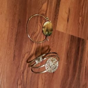 Two silver bracelets.